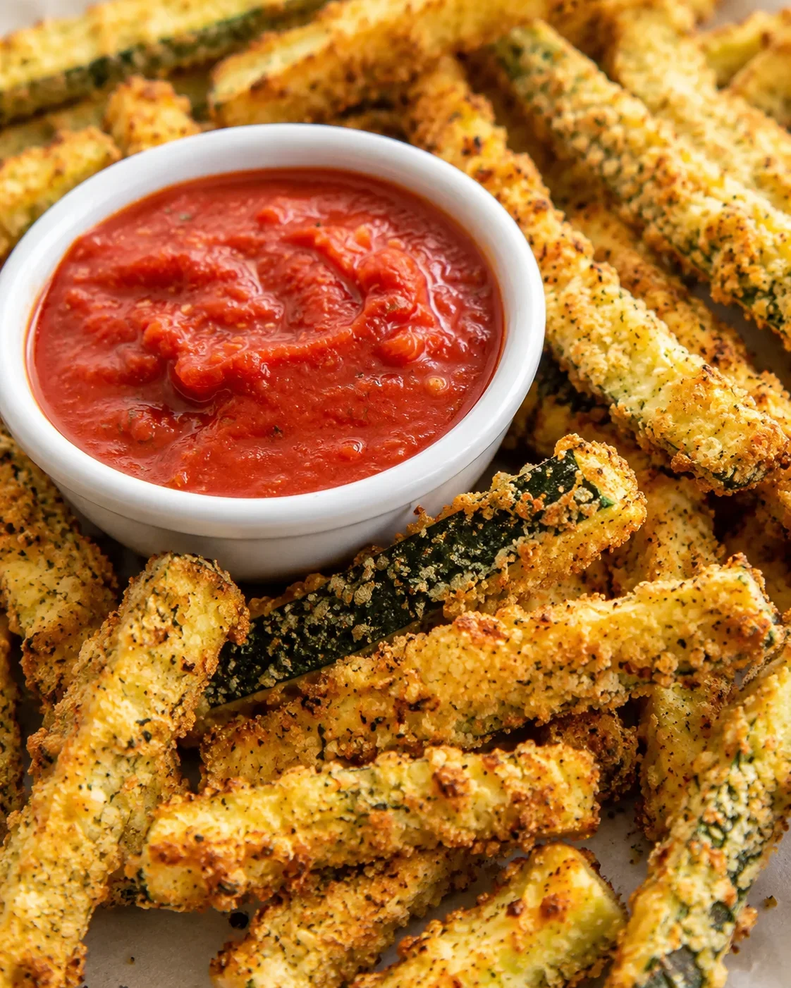 Crispy Air Fryer Zucchini Fries Golden, crunchy zucchini fries served with a side of marinara sauce.